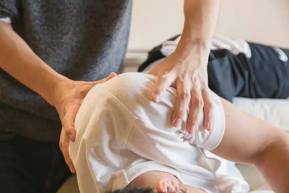 Chiropractor doing some spinal manipulation to the patient and Understanding Whiplash